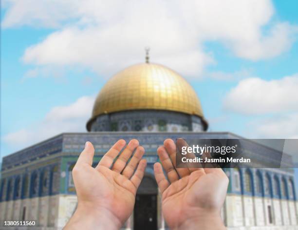 muslim praying in front of al-aqsa mosque in quds / jerusalem - muslim prayer stock pictures, royalty-free photos & images