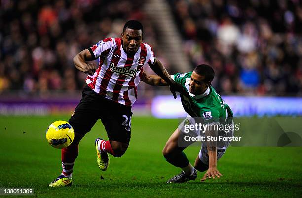 Sunderland striker Stephane Sessegnon skips past Norwich defender Kyle Naughton during the Barclays Premier League game between Sunderland and...