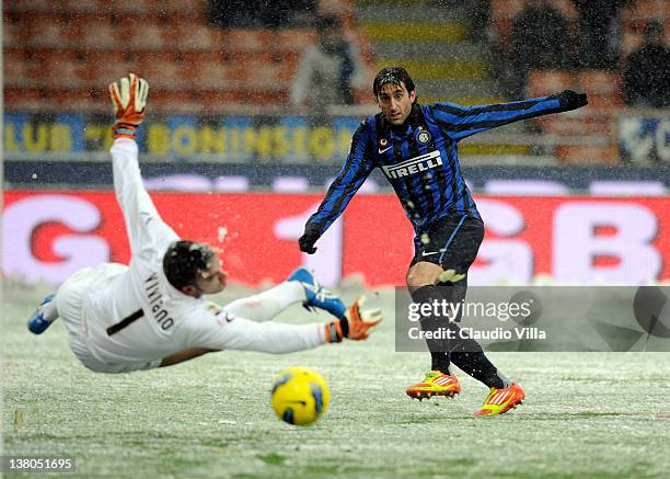 Diego Alberto Milito of FC Inter Milan scores the first goal during the Serie A match between FC Internazionale Milano and US Citta di Palermo at...