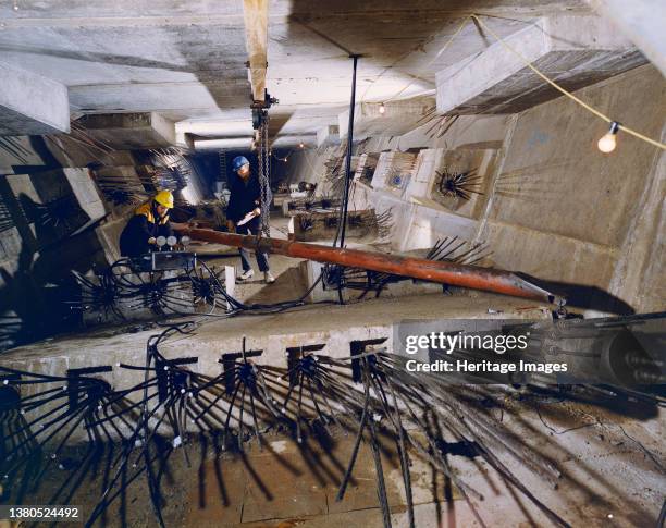 Westway Flyover, A40, Paddington, City of Westminster, London, c1969. Two workers stressing the longitudinal soffit cables inside the box section of...