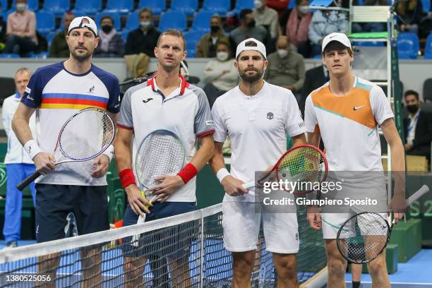 Igor Zelenay and Filip Polasek of Slovakia pose with Simone Bolelli and Jannik Sinner of Italy before the double match during the 2022 Davis Cup...