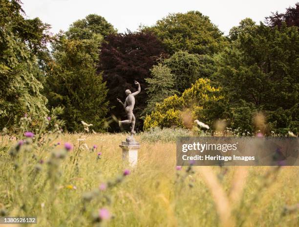 Walmer Castle, Walmer, Dover, Kent, 2019. General view looking across Walmer Castle's paddock, with a statue of Mercury amongst the wild flowers and...
