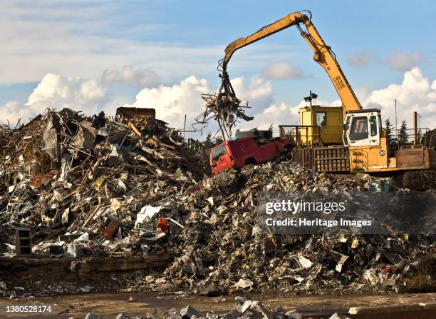 Swindon Scrap Metal Yard, Gypsy Lane, Swindon, 2009. General view of the scrap yard, with a material handling machine at work on top of a pile of...