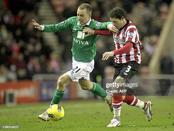 Sunderland's Wayne Bridge vies with Norwich City's English striker Aaron Wilbraham during the English Premier League football match between...