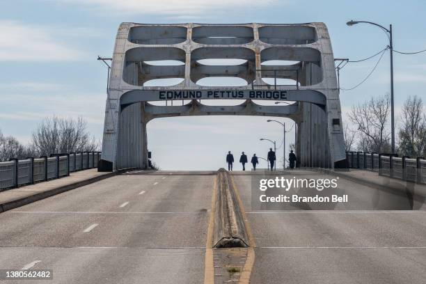 Law enforcement officers work to secure the Edmund Pettus Bridge during commemorations for the 57th anniversary of Selma's 'Bloody Sunday' on March...