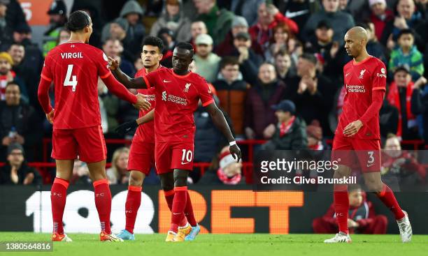 Sadio Mane celebrates with Virgil van Dijk of Liverpool after scoring their team's first goal during the Premier League match between Liverpool and...