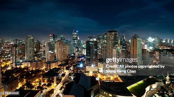 view of makati at night - manila stock pictures, royalty-free photos & images