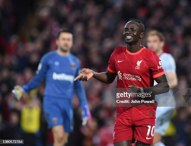 Sadio Mane of Liverpool celebrates after scoring the first goal during the Premier League match between Liverpool and West Ham United at Anfield on...