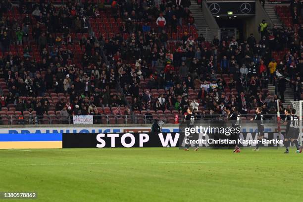 The LED board shows a message that reads 'Stop War - We Against War' ahead of kick off during the Bundesliga match between VfB Stuttgart and Borussia...