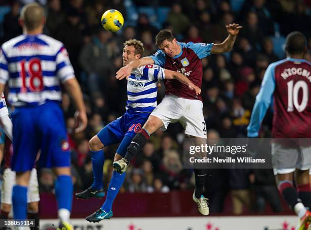 Ciaran Clark of Aston Villa is challenged by Rob Hulse of Queens Park Rangers during the Barclays Premier League match between Aston Villa and Queens...