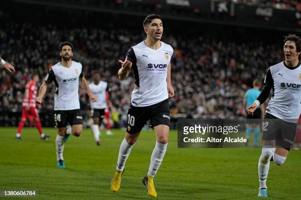 Carlos Soler of Valencia celebrates scoring his sides third goal during the LaLiga Santander match between Valencia CF and Granada CF at Estadio...