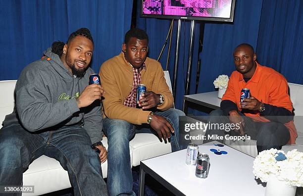 Darnell Dockett of the Arizona Cardinals, Aldon Smith of the San Francisco 49ers and Reggie Wayne of the Indianapolis Colts attend Univision Pepsi...