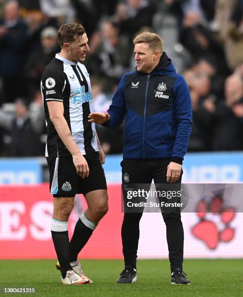 Newcastle Head coach Eddie Howe celebrates with striker Chris Wood after the Premier League match between Newcastle United and Brighton & Hove Albion...