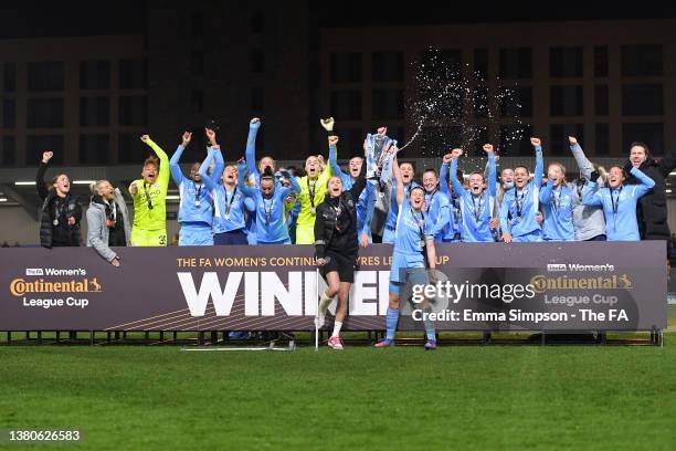 Ellen White of Manchester City lifts The FA Women's Continental Tyres League Cup trophy together with Steph Houghton of Manchester City following...