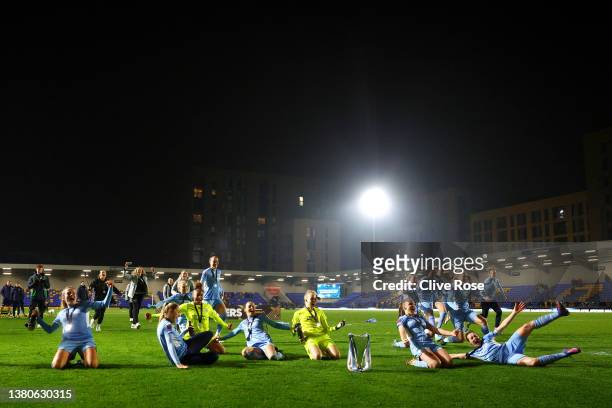 Manchester City players celebrate with the FA Women's Continental Tyres League cup trophy following their side's victory during the FA Women's...