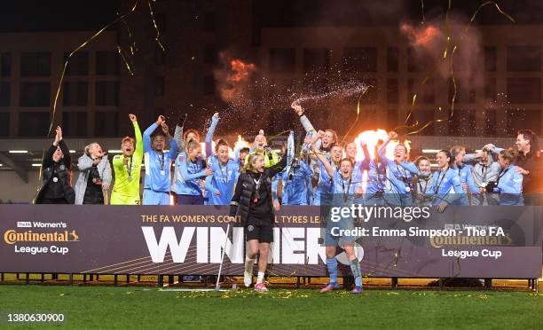 Ellen White of Manchester City lifts The FA Women's Continental Tyres League Cup trophy together with Steph Houghton of Manchester City following...