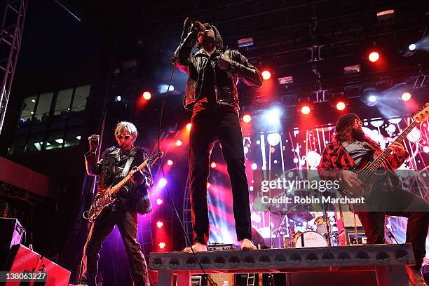 Mike Puwal, Brent James and Jason Kott of Brent James & The Contraband performs during day 6 of the Super Bowl Village on February 1, 2012 in...