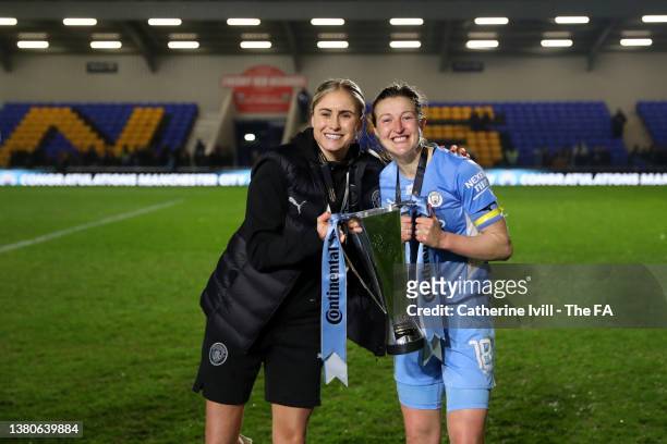 Steph Houghton and Ellen White of Manchester City celebrate with The FA Women's Continental Tyres League Cup trophy following their side's victory in...