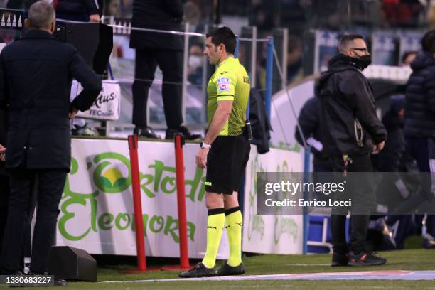 Referee Fabio Maresca checks the VAR before conceding a penalty for Lazio during the Serie A match between Cagliari Calcio and SS Lazio at Sardegna...