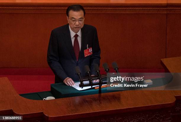 Chinese Premier Li Keqiang speaks from the podium at the opening session of the National Peoples Congress at the Great Hall of the People on March 5,...