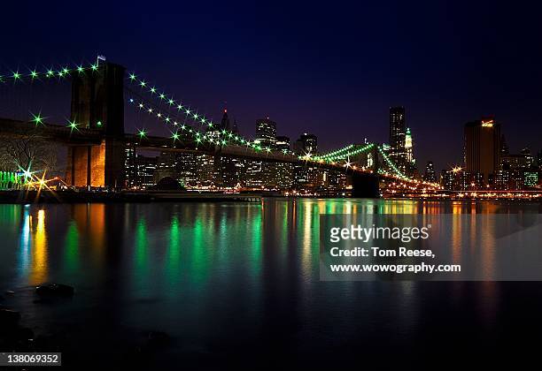 night view of brooklyn bridge - wowography stock pictures, royalty-free photos & images