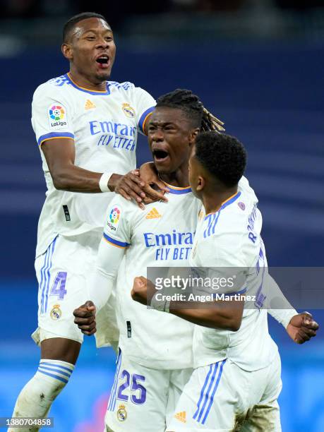 Eduardo Camavinga of Real Madrid celebrates with David Alaba and Rodrygo Goes after scoring their team's first goal during the LaLiga Santander match...