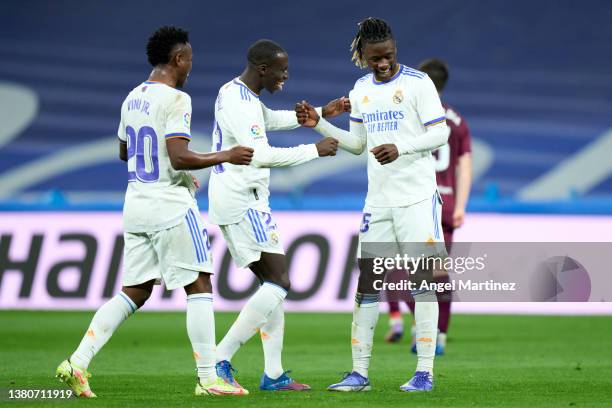 Eduardo Camavinga of Real Madrid celebrates with Ferland Mendy and Vinicius Junior after scoring their team's first goal during the LaLiga Santander...