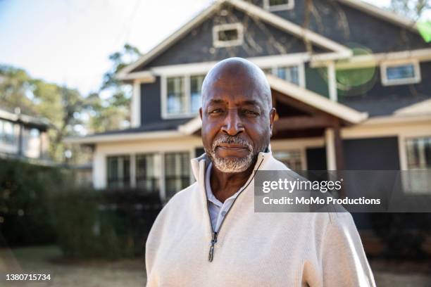 portrait of senior man in front of his house - black man stock pictures, royalty-free photos & images