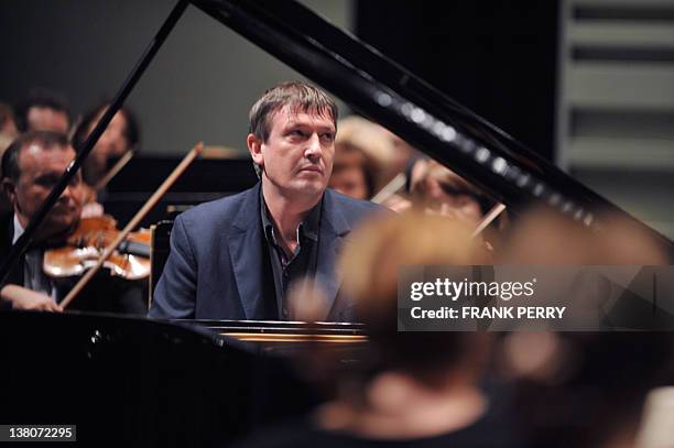 Russian pianist Boris Berezovsky performs a Rachmaninov music piece with the Ural Philharmonic Orchestra in Nantes, western France on February 1...