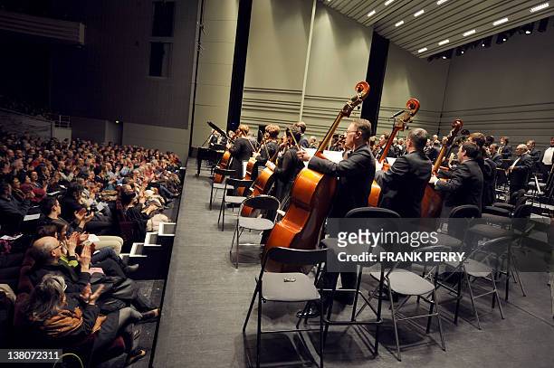Members of the Ural Philharmonic Orchestra acknowledge the audience after performing in Nantes, western France on February 1 during the 18th edition...