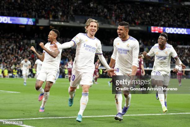 Luka Modric of Real Madrid CF celebrates scoring their second goal with teammate Carlos Casemiro during the LaLiga Santander match between Real...
