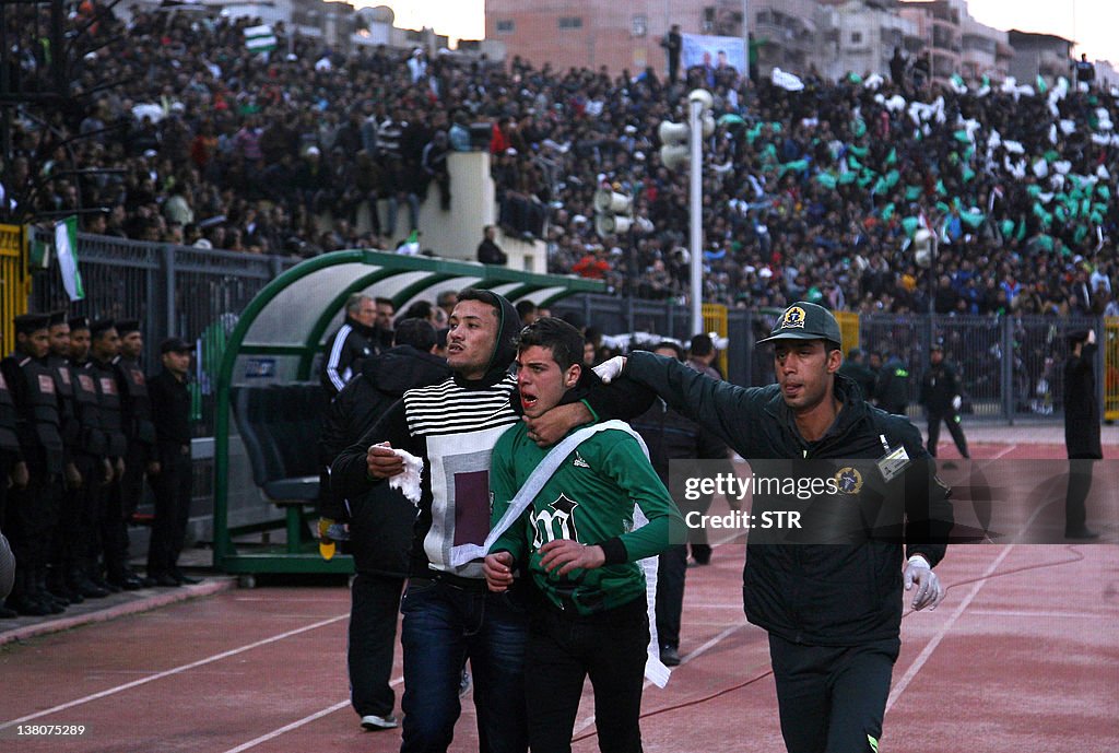 A wounded Egyptian fan of Al-Masry is es