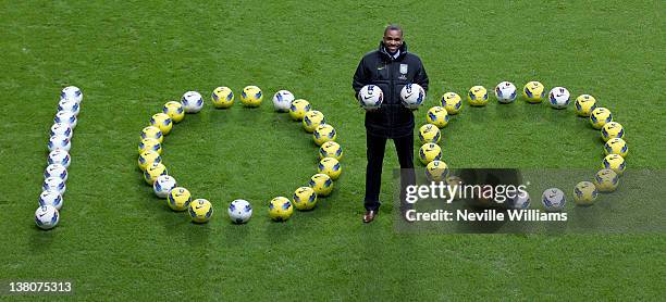 Darren Bent of Aston Villa poses for a photo to celebrate scoring his 100th career Barclays Premier League goal during the game between Aston Villa...