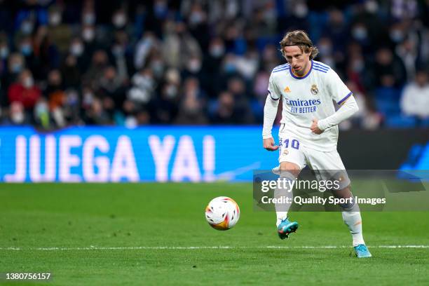 Luka Modric of Real Madrid passes the ball during the La Liga Santander match between Real Madrid CF and Real Sociedad at Estadio Santiago Bernabeu...