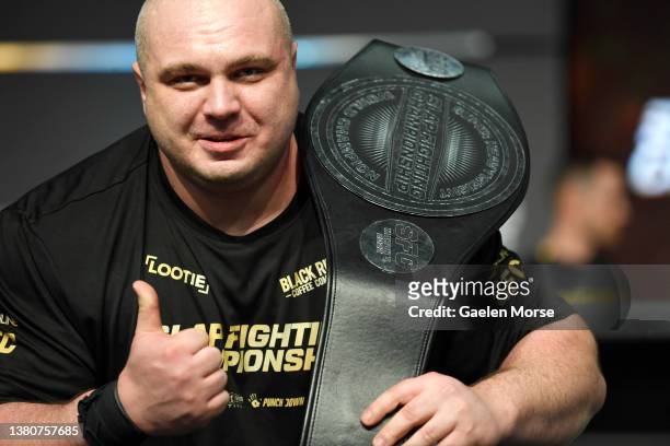 Dawid “Zaleś” Zalewski poses with his championship belt at the Arnold Sports Festival in Columbus Convention Center on March 05, 2022 in Columbus,...