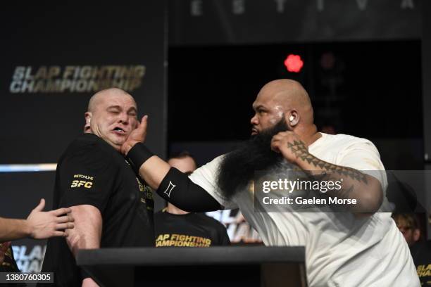 Koa “Da Crazy Hawaiian” Viernes slaps Dawid “Zaleś” Zalewski in the super heavyweight bout at the Arnold Sports Festival in Columbus Convention...