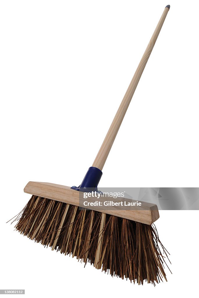 Sweeping broom on white background