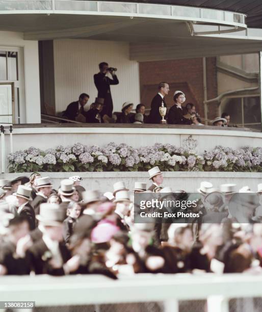 Princess Elizabeth and Prince Philip watching a race at Ascot Racecourse, Berkshire, 1952.