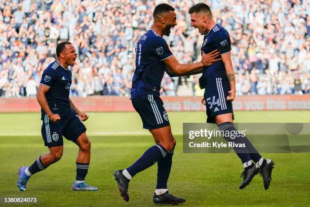 Remi Walter of Sporting Kansas City celebrates with teammates after scoring the games only goal against the Houston Dynamo during the second half at...