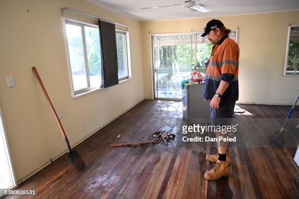 Warren Vine prepares for another day of cleaning in his flood-affected home on March 06, 2022 in Brisbane, Australia. Residents of southeast...