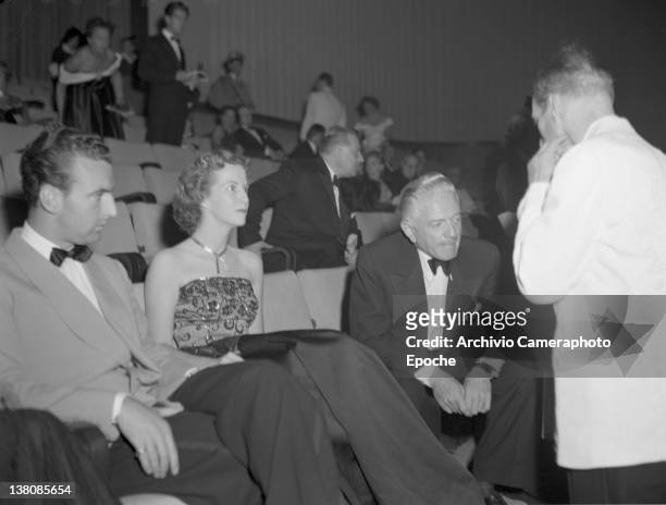 American actress Betsy Blair sitting with Luparini and Litvack in the front row during the Venice Movie Festival, 1949. American Actress