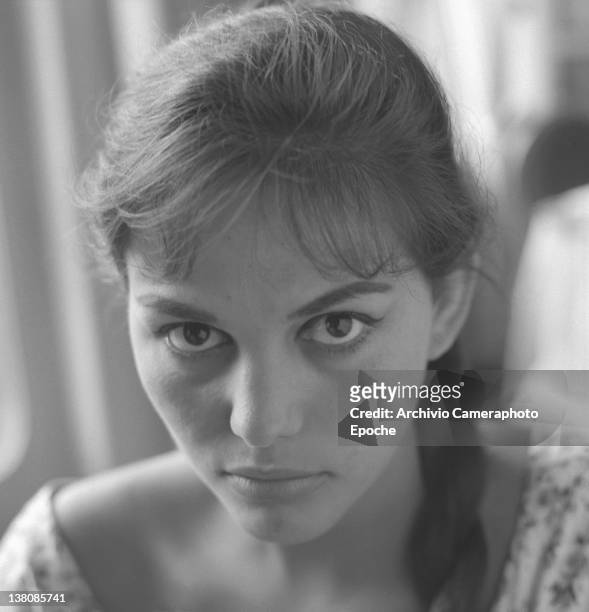 Italian actress Claudia Cardinale, portrayed while wearing a plait and a floral dress, Venice, 1958.