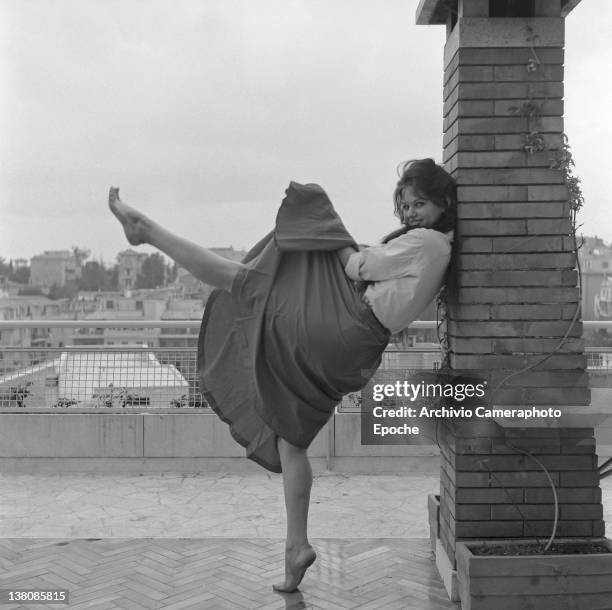 Italian actress Claudia Cardinale portrayed while dancing on a terrace, Rome, 1959.