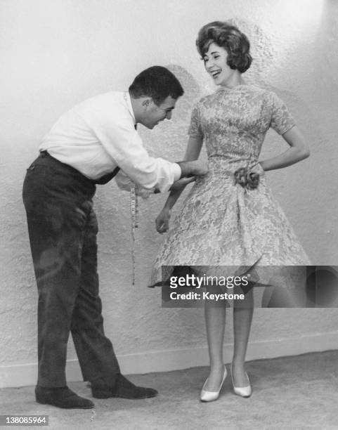 Year-old singer Teresa Duffy models a gown of pale blue Chantilly lace which she will wear to the Eurovision Song Contest, 10th February 1961. John...