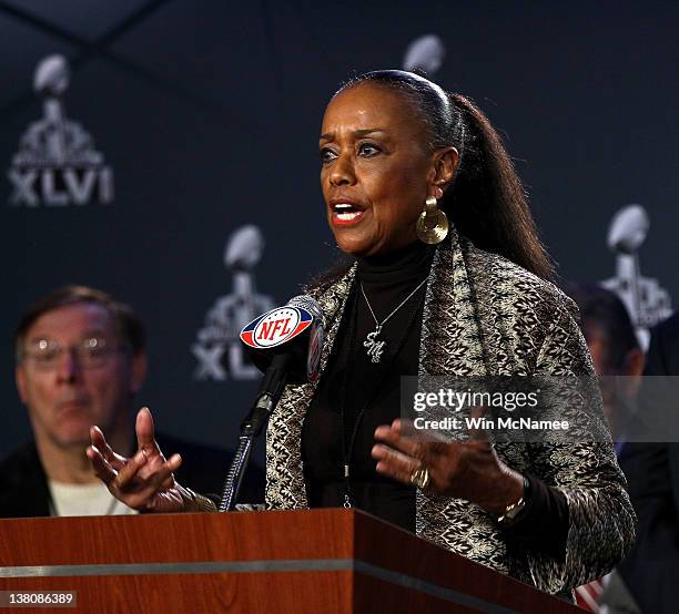 Sylvia Mackey speaks at the podium during a press conference held by the NFL Alumni Association at the Super Bowl XLVI Media Center in the J.W....