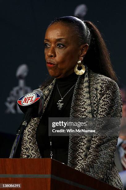 Sylvia Mackey speaks at the podium during a press conference held by the NFL Alumni Association at the Super Bowl XLVI Media Center in the J.W....