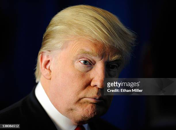 Donald Trump speaks to members of the media before endorsing Republican presidential candidate, former Massachusetts Gov. Mitt Romney at the Trump...