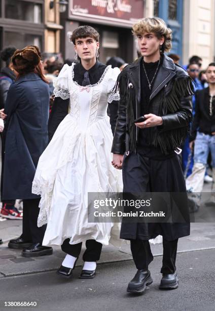 Guest is seen wearing a white wedding dress outside the Vivienne Westwood show during Paris Fashion Week A/W 2022 on March 05, 2022 in Paris, France.