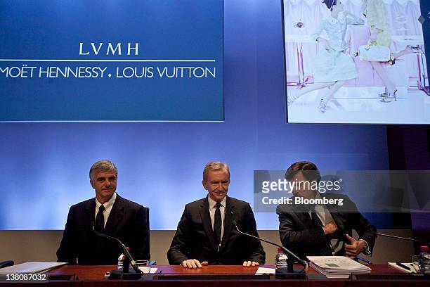Antonio Belloni, managing director of LVMH Moet Hennessy Louis Vuitton SA, left, Bernard Arnault, chairman and chief executive officer of LVMH Moet...