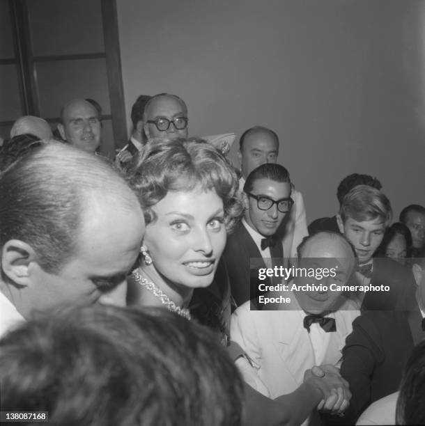 Italian actress Sophia Loren surrounded by the crowd atthe Venice Movie Festival, 1958.